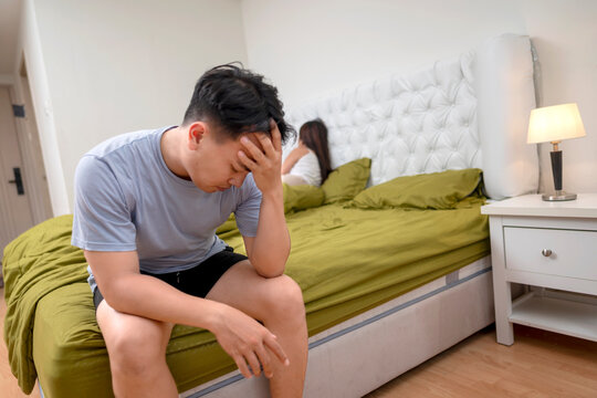Indonesian southeast asian man disappointed in himself because of premature ejaculation and erectile problems. The man lost confidence with an unhappy and unsatisfied wife