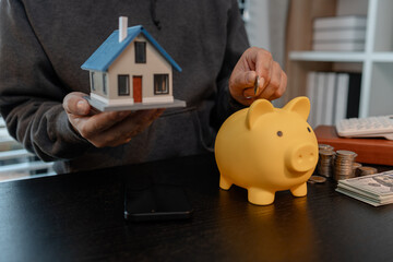 a man uses his savings to buy his dream home, this man plans his finances to buy a home, he uses...