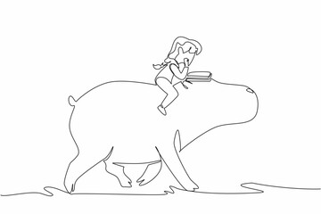 Single continuous line drawing girl reading book on cute hippopotamus. Learn to be closer to nature. Read books very seriously. Girl Reading Book at Animal Back. One line design vector illustration