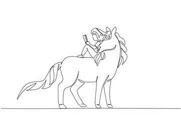 Single one line drawing the girl reading book on cute unicorn. Sitting back. Relaxed but very serious reading. The nerd. Girl Reading Book at Animal Back. Continuous line design graphic illustration