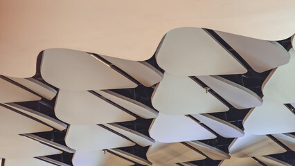 A captivating view of a modern ceiling with layered, abstract design elements