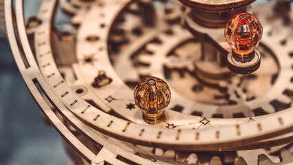 This intricate wooden mechanical music box model features astronomical elements and complex designs