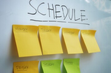 Colorful sticky notes arranged by day of the week under the word 