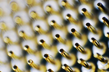 The dense array of metallic pins