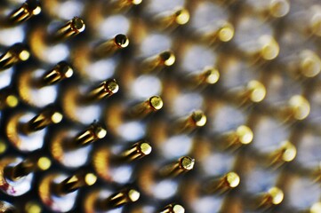 The blurred golden pins with delicate textures