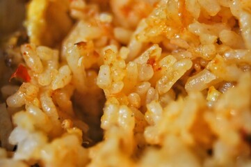 Rice spicy and flavorful, showcasing vibrant colors and a mix of oils and seasonings