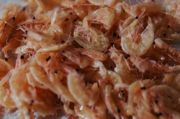 Raw shrimp, details of the small, pink seafood