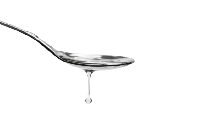 a spoon with liquid dripping from it