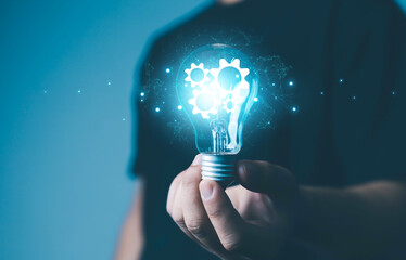 businessman hand holding light bulb concept with innovation and inspiration business idea ideas and imagination creativity and inspiration science innovation with networking analysis and develop innov