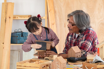 Carpenter family lifestyle activities concept, happy old age grandpa carpentry owner spends time...
