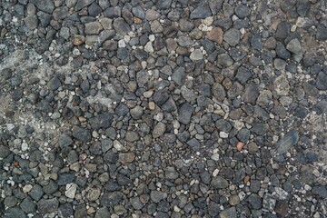 view of a gravel surface, showcasing an array of small rocks and pebbles, perfect for natural texture backgrounds