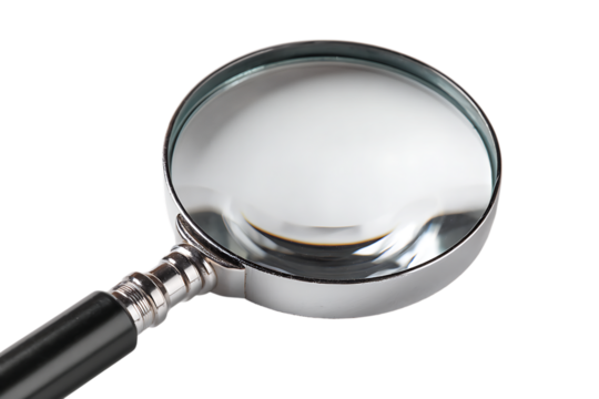 Close up of a magnifying glass on a black background