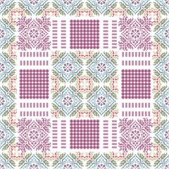Traditional ethnic or folk embroidery patterns are similar to these themes. The design's center and border parts consist of repeated tiles in blue, pink, green, and yellow with diamond and flower-like