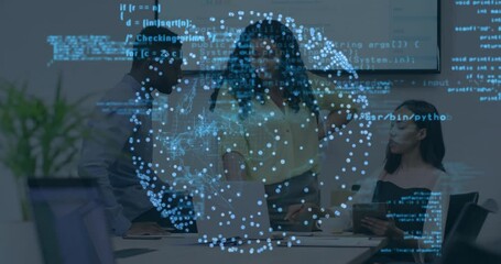 Colleagues gathering around table activating code sphere while analyzing technology overlay data - Powered by Adobe