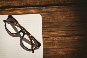 Close-up of eyeglasses on book