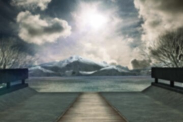 Boardwalk leading to sea during sunset
