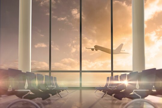 Fototapeta Airplane flying past departures lounge window