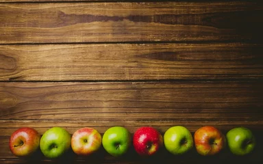 Fototapete Red and green apples on table © vectorfusionart