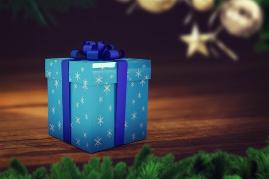 Fototapeta Flat design showing blue snowflake gift box on table, framing boughs and hanging baubles with star