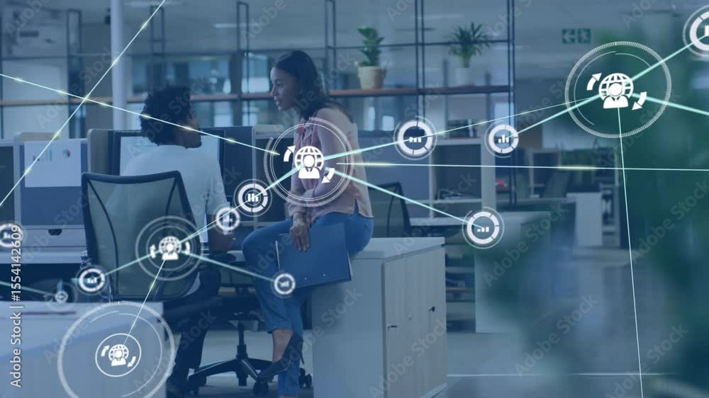Poster male sitting at computer and female on desk discussing project initiating business data network