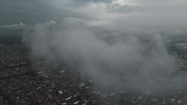 Flying through a cloud in the sky above Ecatepec, Mexico