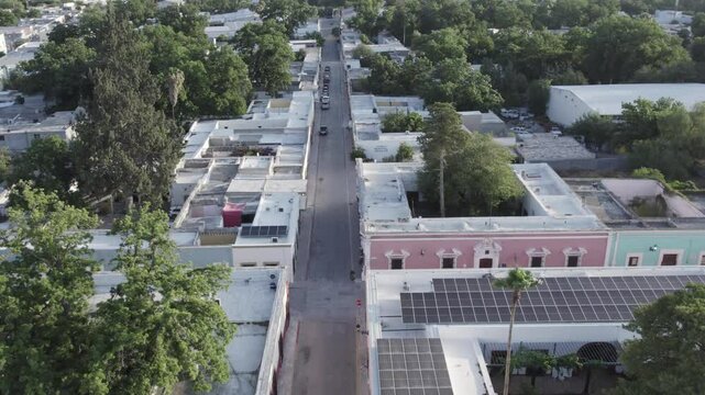 Drone footage at sunrise over Parras de la Fuente, showing urban layout and surrounding terrain under clear sky conditions, captured in stable 4K resolution with smooth tracking and overhead shots.