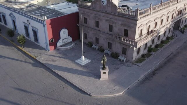 Drone footage at sunrise over Parras de la Fuente, showing urban layout and surrounding terrain under clear sky conditions, captured in stable 4K resolution with smooth tracking and overhead shots.