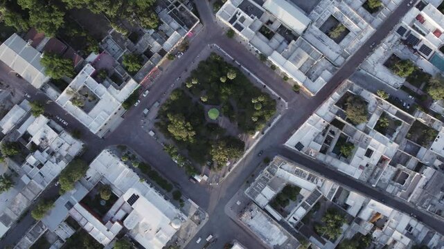 Drone footage at sunrise over Parras de la Fuente, showing urban layout and surrounding terrain under clear sky conditions, captured in stable 4K resolution with smooth tracking and overhead shots.