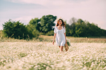 Daisy Field Woman Summer: Girl walks through a field of daisies during the daytime.