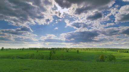 A Breathtaking Green Landscape Sprawled Wide Under Dramatic and Stunning Skies Above Us All Time lapse.