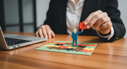 Businesswoman Completing a Puzzle on Wooden Desk with Laptop in an Office Setting Focus on Solving Strategy Problems and Achieving Success in Corporate World