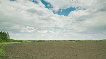 A Broad and Expansive Agricultural Landscape Beneath Dramatic, Captivating Skies Above Time lapse.