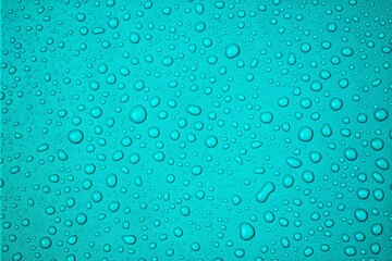 Turquoise Surface Adorned with Water Droplets A Refreshing Texture