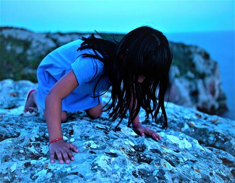 looking for shells on the rocks 2