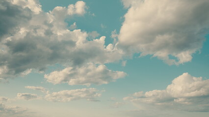 A Serene and Beautiful Sky Filled with Fluffy White Clouds and a Tranquil Blue Background