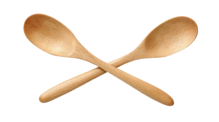 two wooden spoons crossed on a white background
