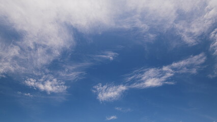 Obraz premium Time lapse. A Serene Blue Sky adorned with Wispy Clouds, Ideal for Capturing Beautiful Nature Scenes