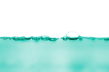 Abstract green beverage liquid fluid surface with air bubbles, liquid wave bubbles isolated on white background. Copy space.