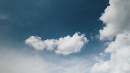Time lapse. The stunningly beautiful cloudy sky is contrasted against a vibrant blue background
