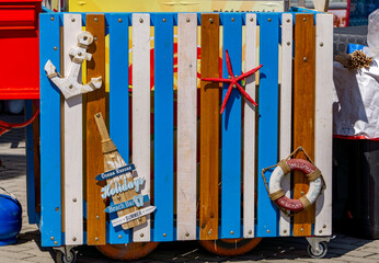 Colorful nautical-style decoration with elements like an anchor, lifebuoy, starfish, and...