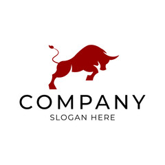 Silhouette of a strong aggressive attacking bull logo. Vector illustration.