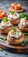 Roasted mushroom caps filled with savory salmon mixture topped with a dollop of whipped cream and fresh dill