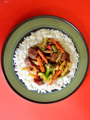 Beef and vegetable stir fry with jasmine rice and soy and honey sauce. 