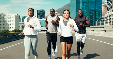 Sports, group and people running in city with workout, health or training for marathon. Fitness, friends and athletes with cardio exercise for race practice, wellness or team challenge in urban town.