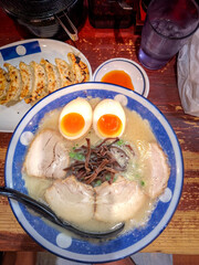 Ramen, Japanese noodle dish consists of Chinese-style wheat noodles served in broth which common flavors are soy sauce and miso, topped with sliced pork, bamboo shoots and boiled egg
