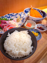 Japanese lunch set, rice with sashimi and fried fish