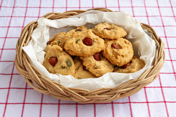 Homemade Healthy Cereal Cookies with almond top in container woven