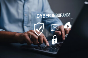 Man using laptop, securing data with cyber insurance