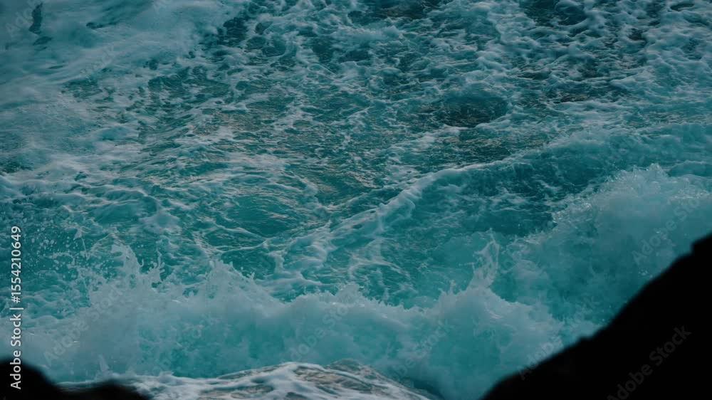 Poster slow-motion close-up of ocean waves crashing with powerful motion and texture along the coast of sei