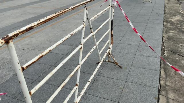 Old rusty steel movable traffic barrier.